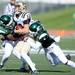 Western Michigan senior Robert Arnheim is tackled by Eastern Michigan junior Marcell Rose and senior Willie Williams during the second half against Western Michigan at Rynearson Stadium on Saturday afternoon. Melanie Maxwell I AnnArbor.com